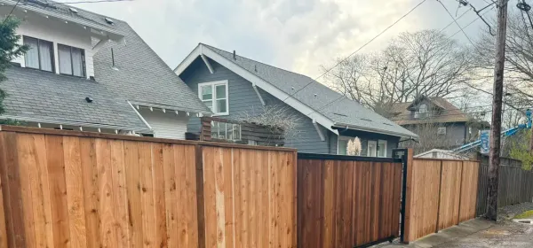 Cedar privacy fence with a matching gate, installed by Evergreen Gate & Fence